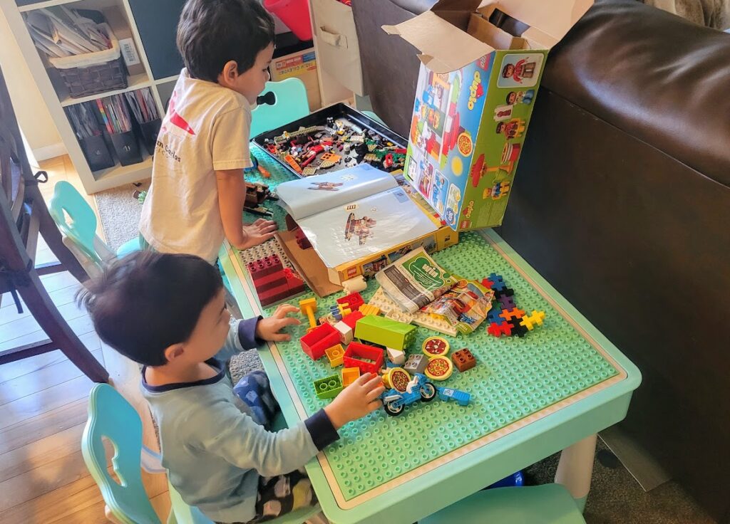 Children playing with LEGOs and duplos