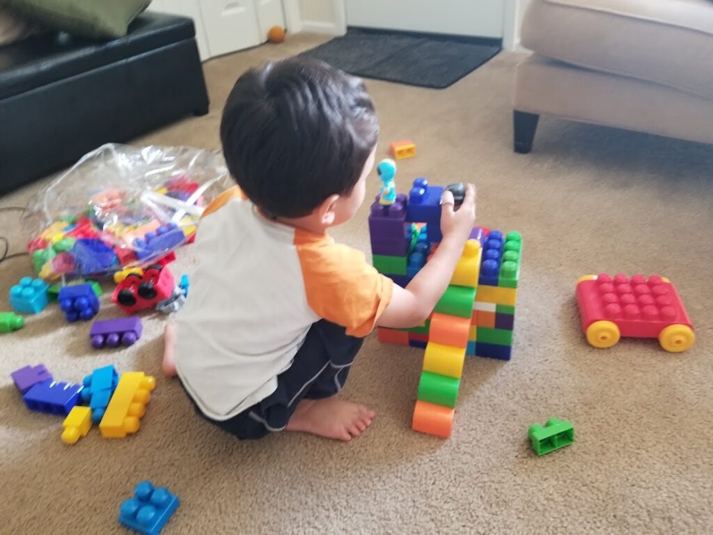 Child playing with duplos