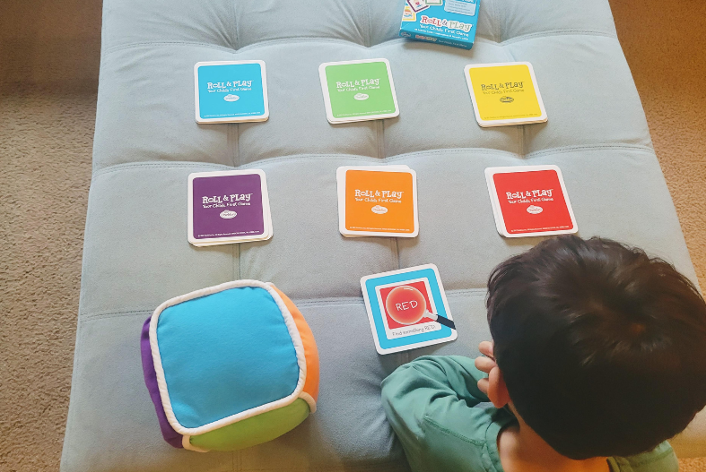 Toddler playing Roll & Play game