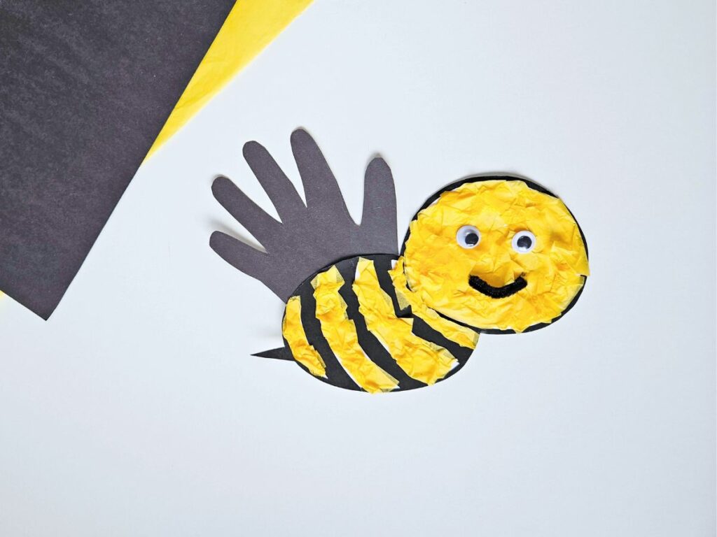 Bee craft with googly eyes and pipe cleaner mouth added