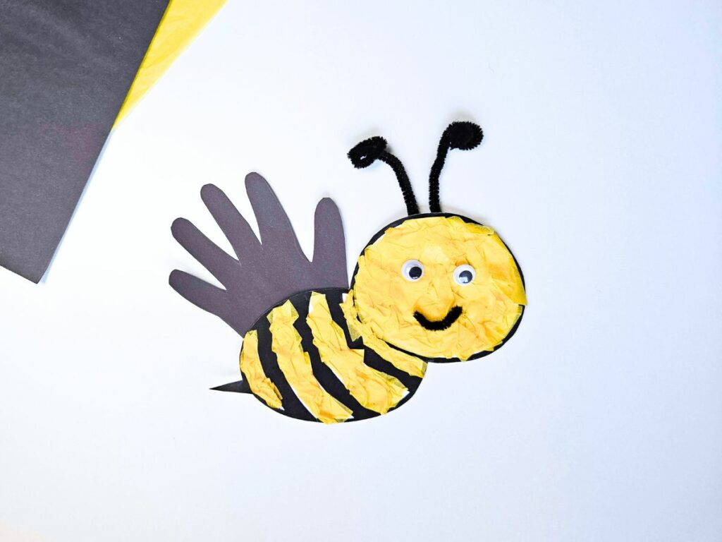 Completed bee handprint craft for kids