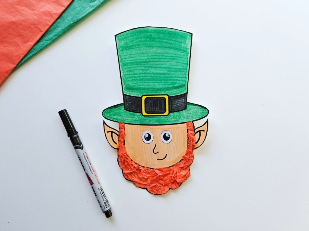 Draw the nose and mouth onto the leprechaun craft
