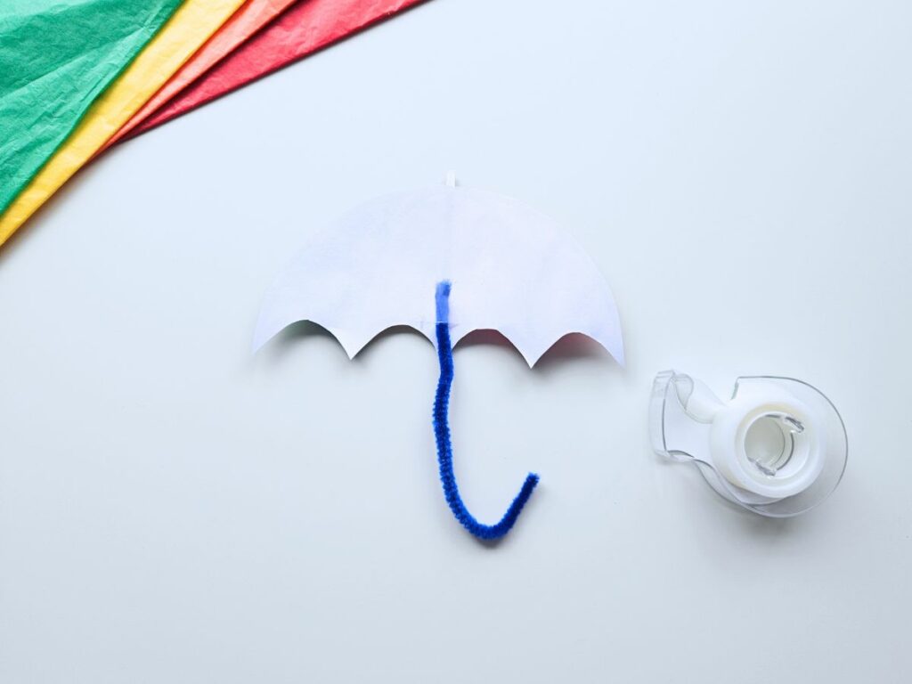 Materials to make umbrella tissue paper craft