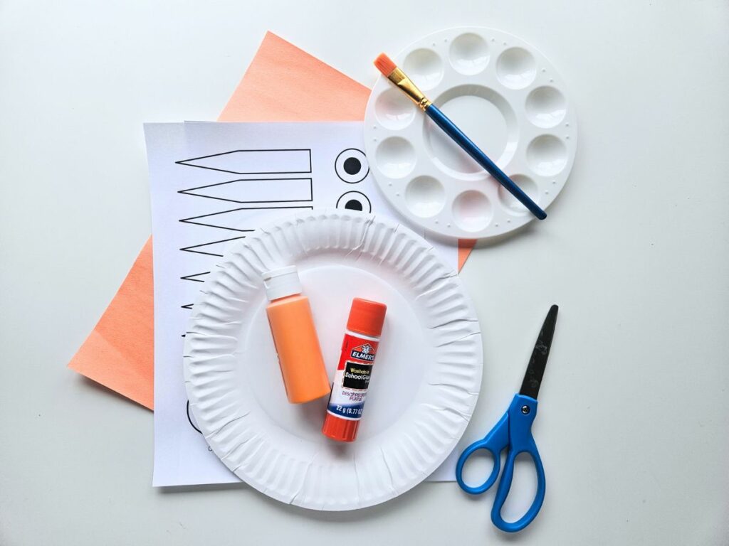 Supplies to make the paper plate crab craft