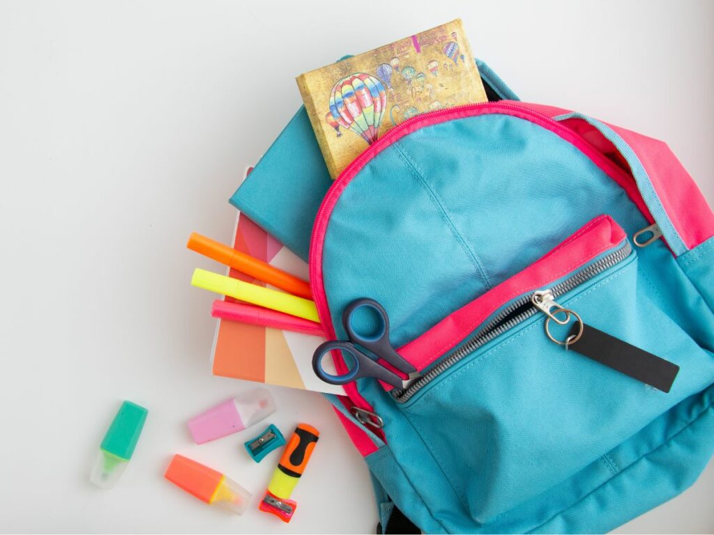 A backpack with school supplies- Back to school tips