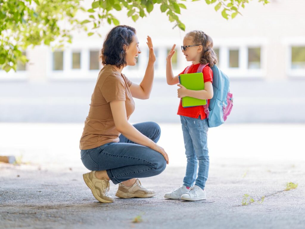 Mother and child high fiving