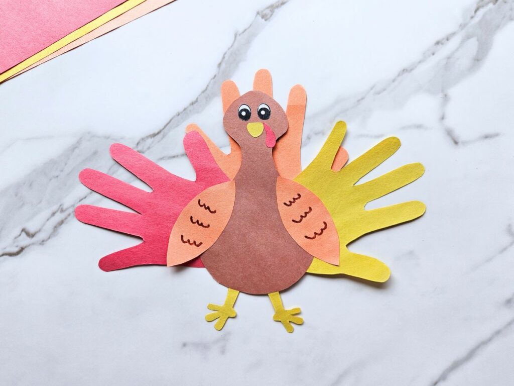 Completed turkey handprint craft for kids