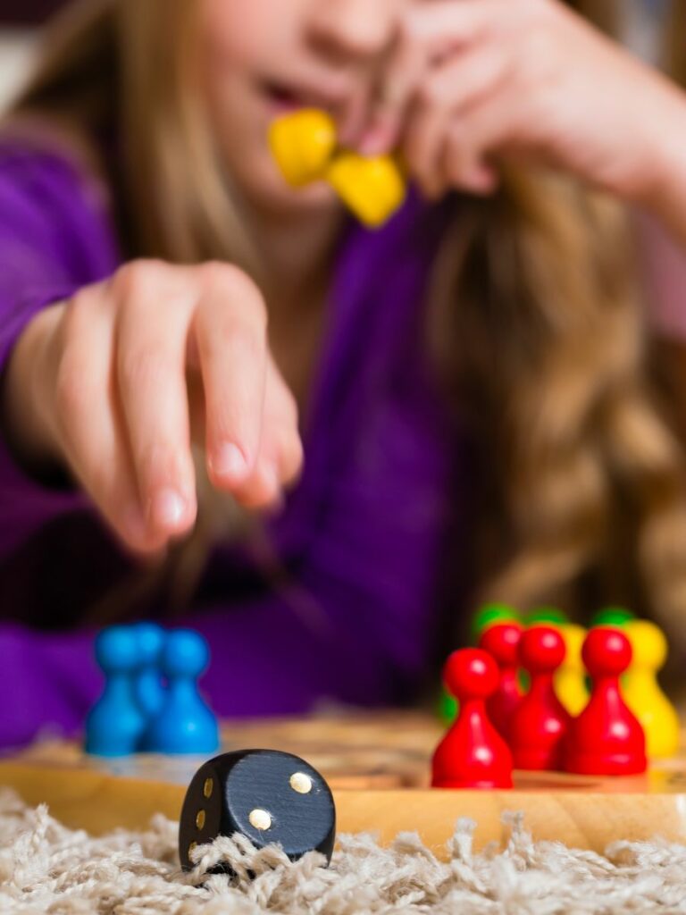 4 year old playing a board game